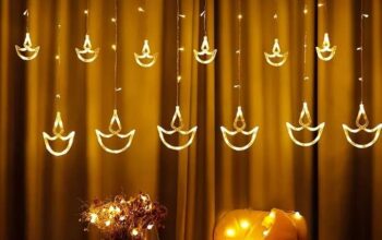 Illuminate your celebrations with Desidiya’s Warm White Diya Light Curtain. Featuring 12 hanging diyas and 8 flashing modes, this energy-efficient LED string light is perfect for Diwali, weddings, and year-round decor.